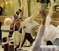 elderly people doing yoga